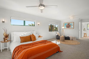 White blackout roller blinds in master bedroom
